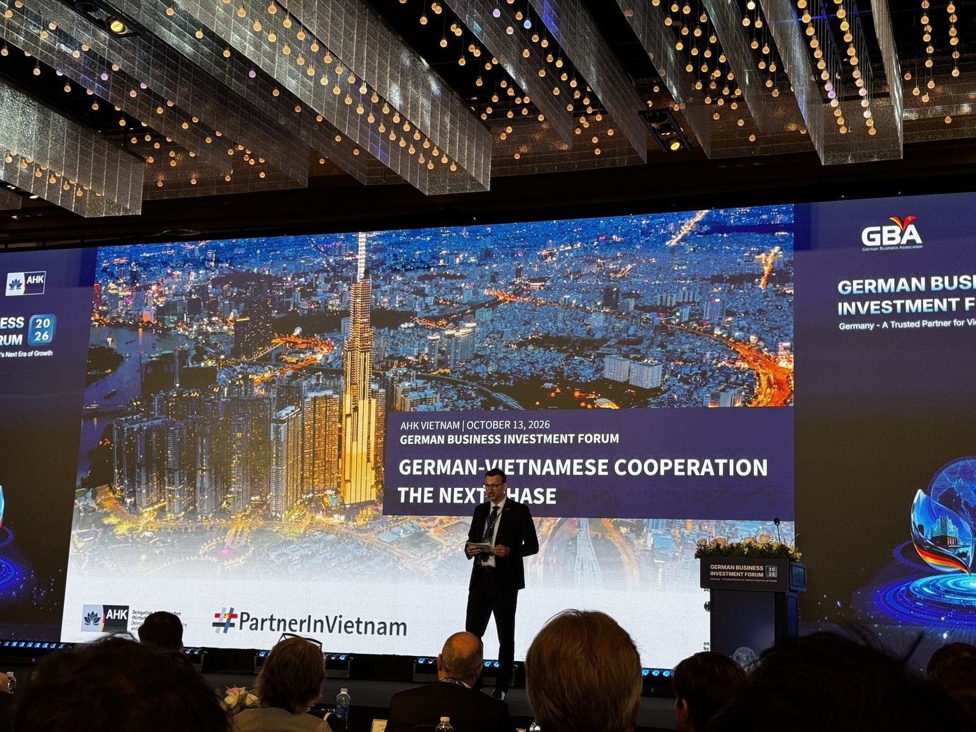 AHK Vietnam presentation slide "German-Vietnamese Cooperation: The Next Phase" at the German Business & Investment Forum 2026