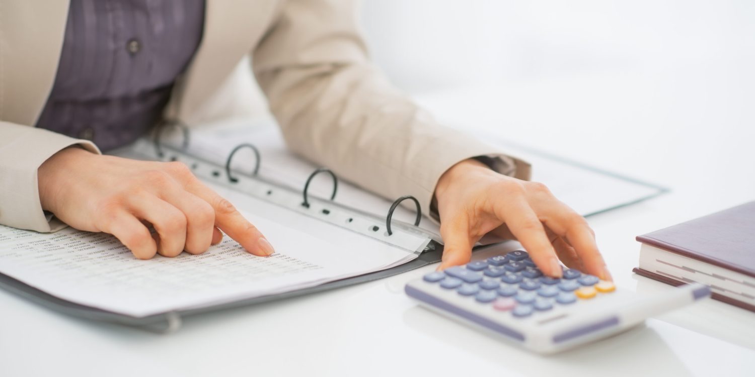 Closeup on business woman working with documents