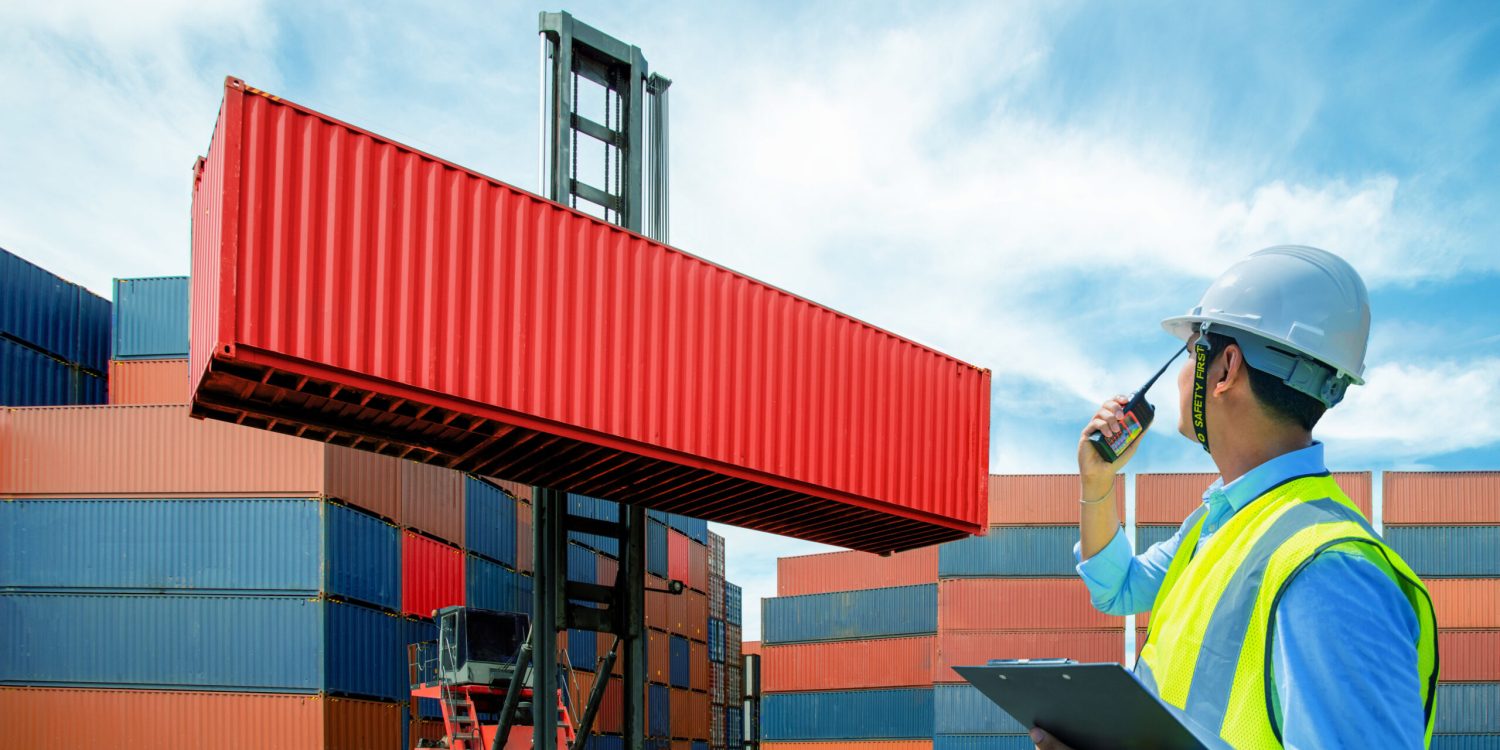 Foreman control loading containers box from cargo freight ship for import export, Foreman control industrial container cargo freight ship, Business logistic concept, Import and export concept